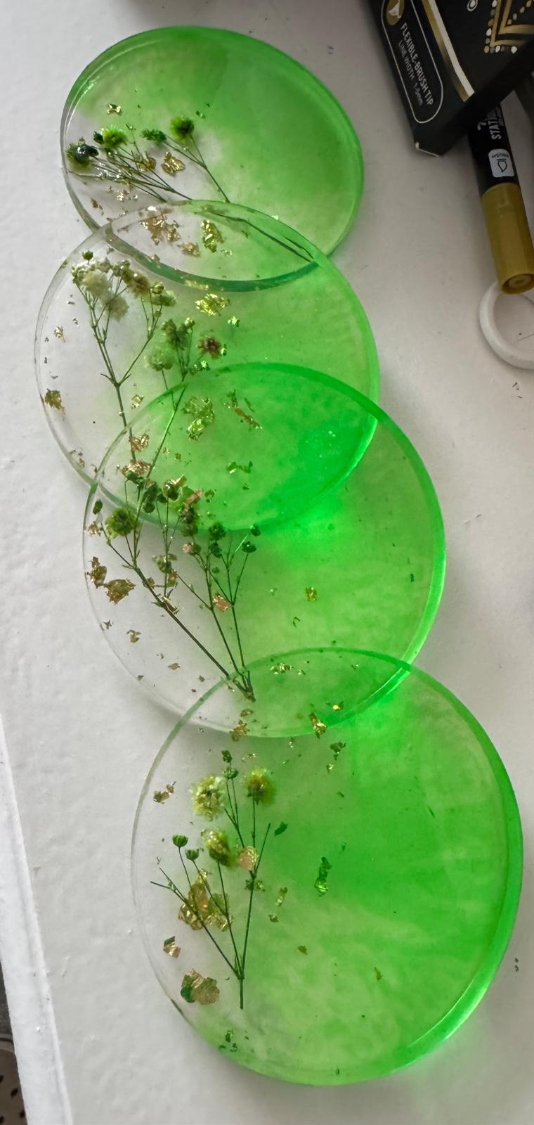 Green resin coasters with dried flowers and gold leaf