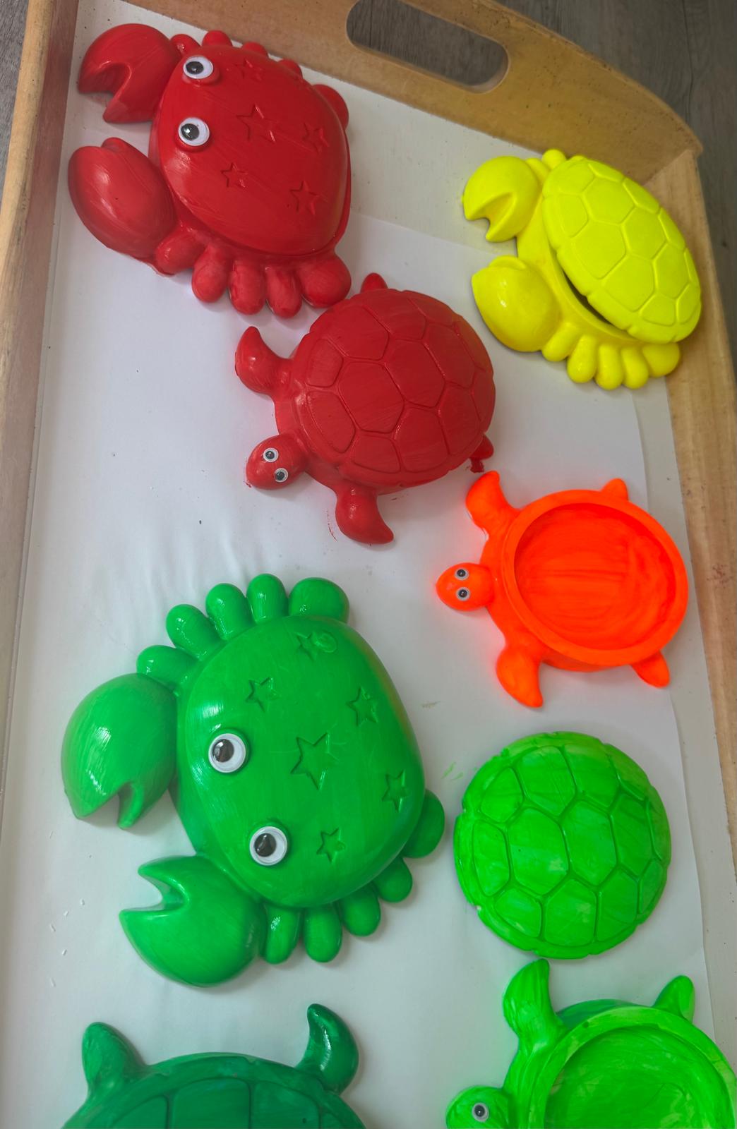 Painted plaster crab and turtle casts